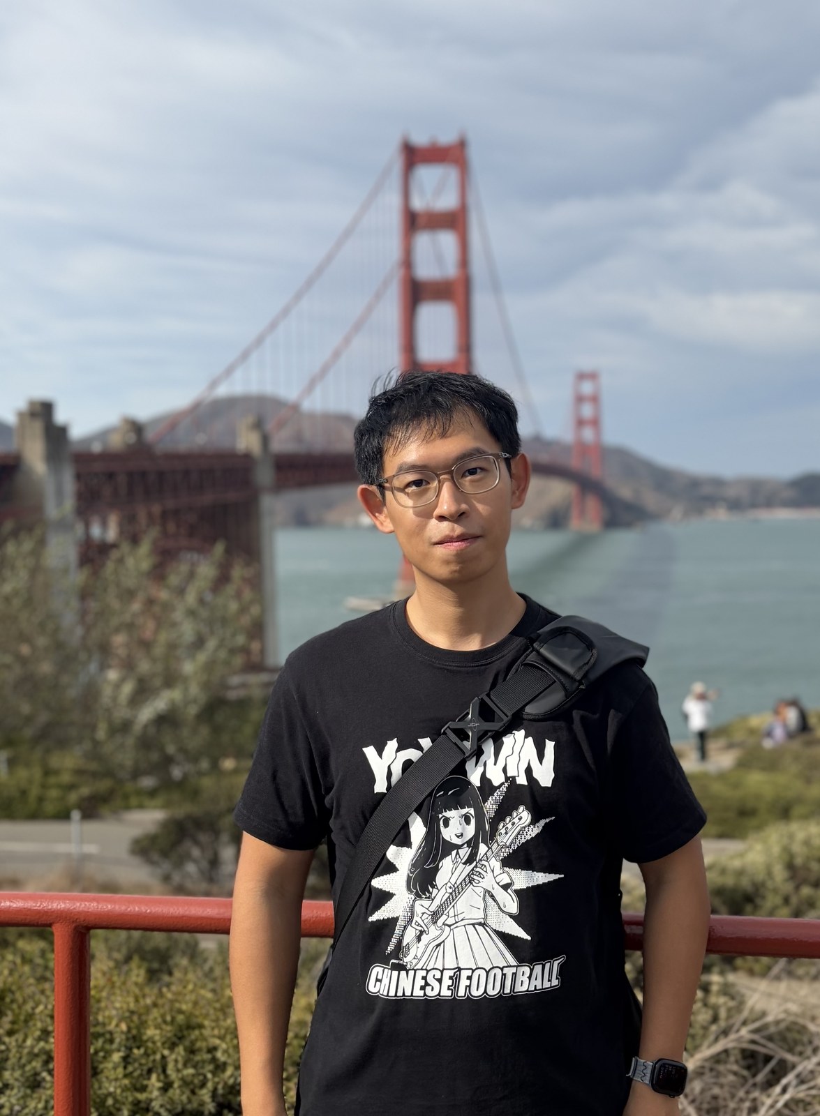 Portrait of Jie Chen in front of the Golden Gate Bridge